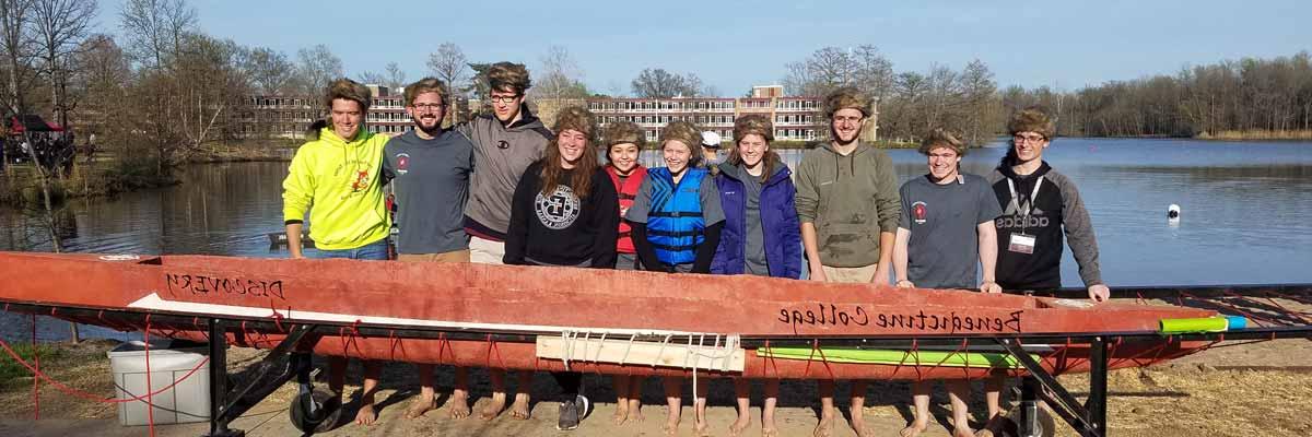 Benedictine College ASCE Student Chapter in front of a conrete canoe